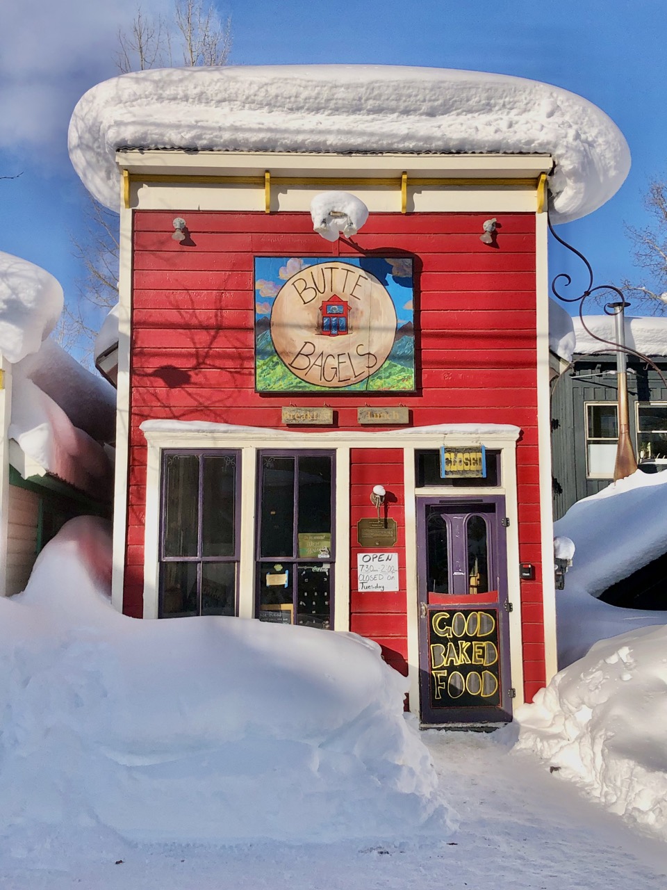 6 wonderful winter places to visit in colorado - snowy crested butte historical bright red building 