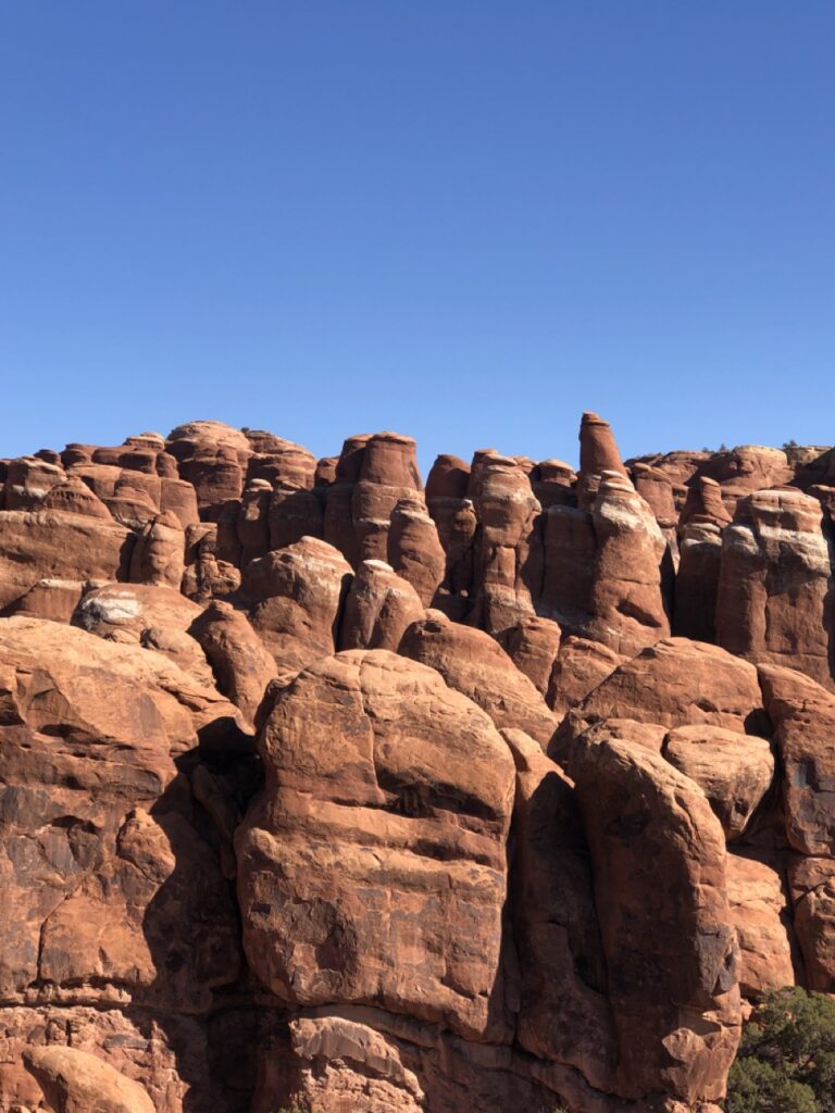 unique rounded rock shapes with bright blue sky background. 
