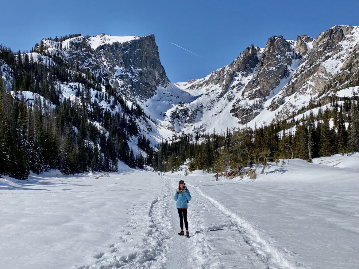 Frozen Emerald Lake and snowy Rocky Mountains in background