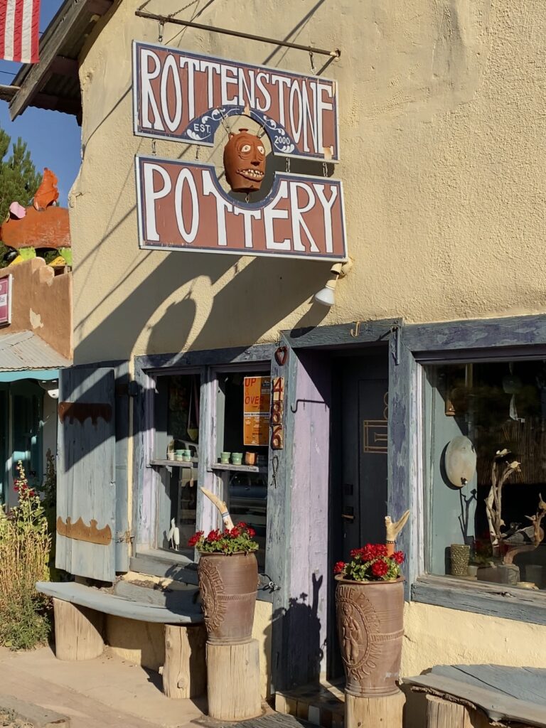 neutral toned pottery shop with flower decor