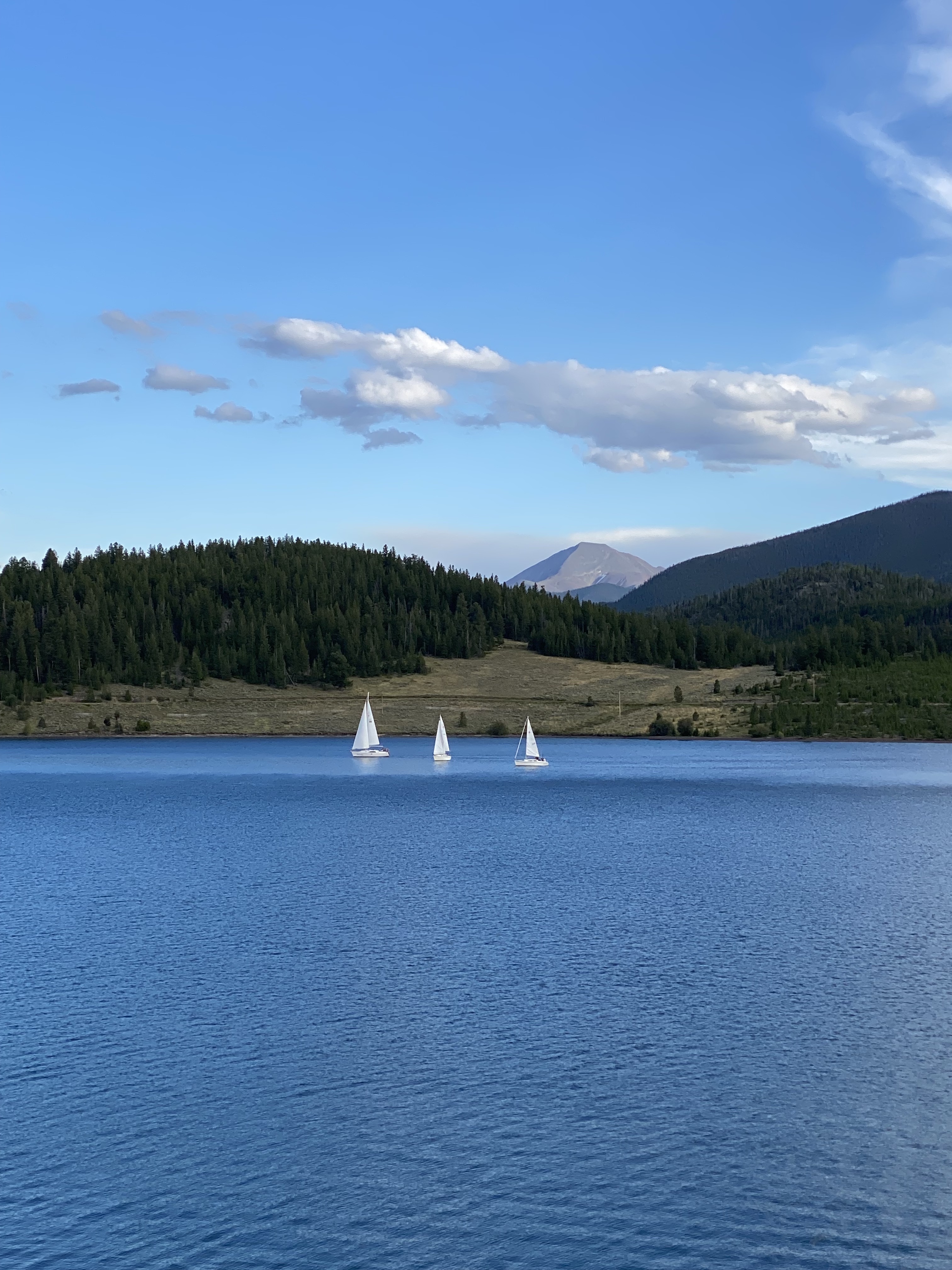 blue lake with white sailboats. 7 stunning lakes to visit in colorful colorado