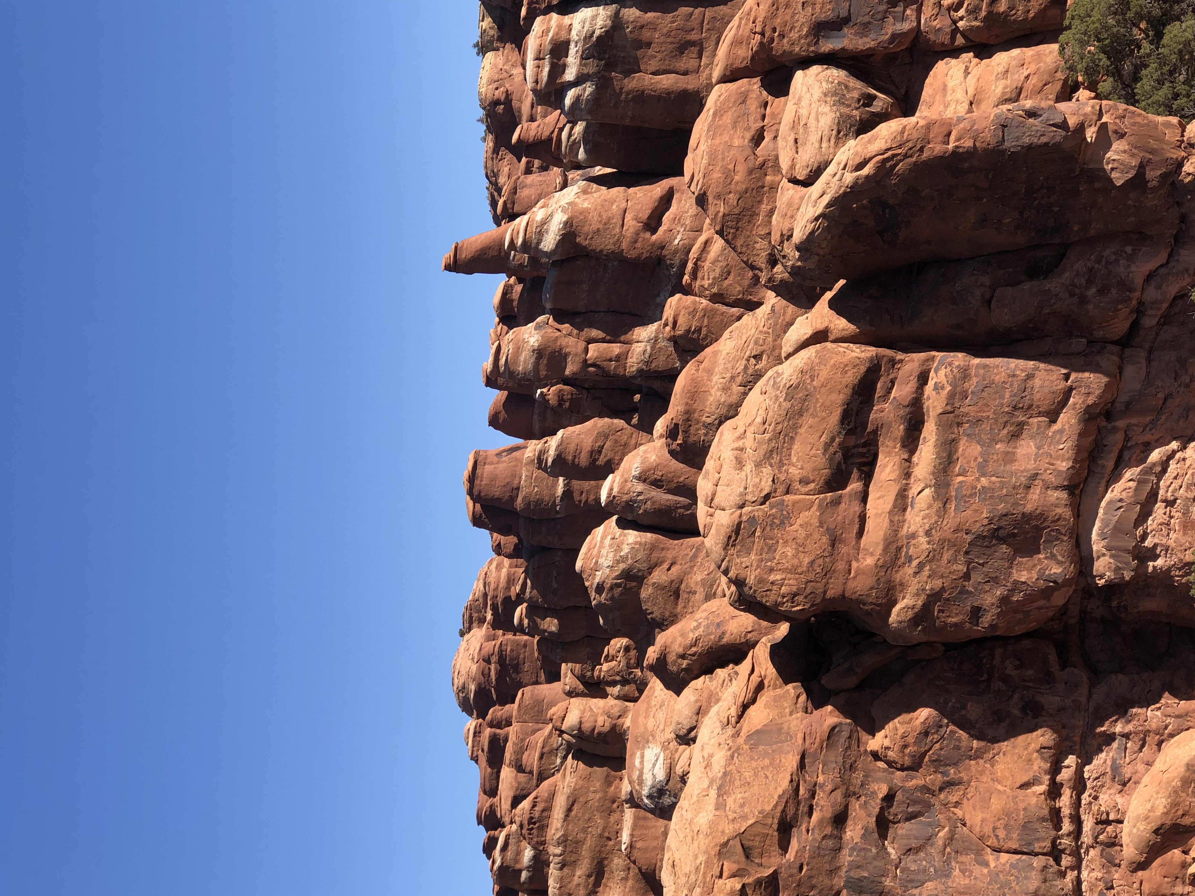 blue sky background with red rounded rocks. guide to 7 spectacular hiking trails in moab, utah
